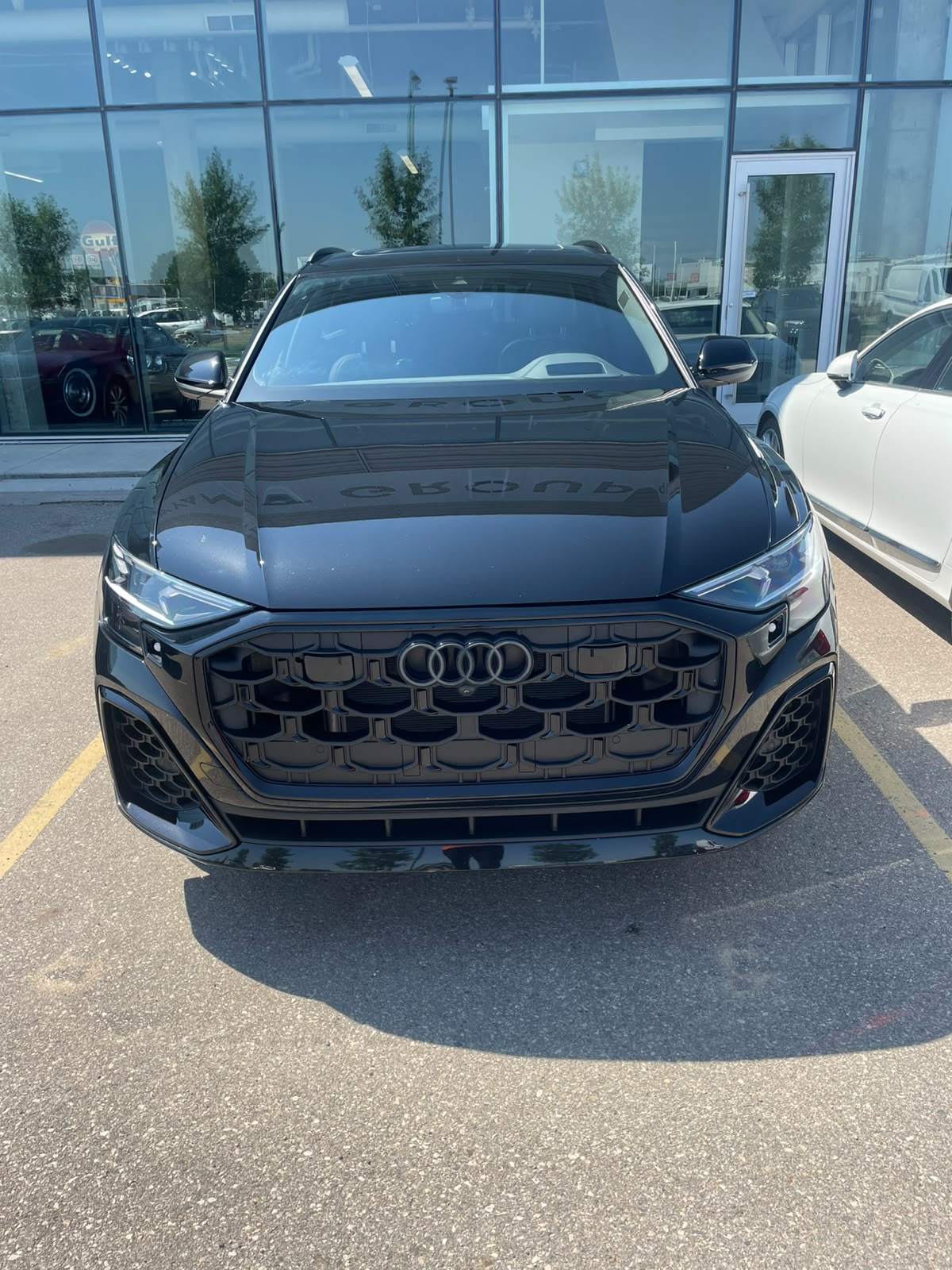 Glossy black SUV with deep reflections