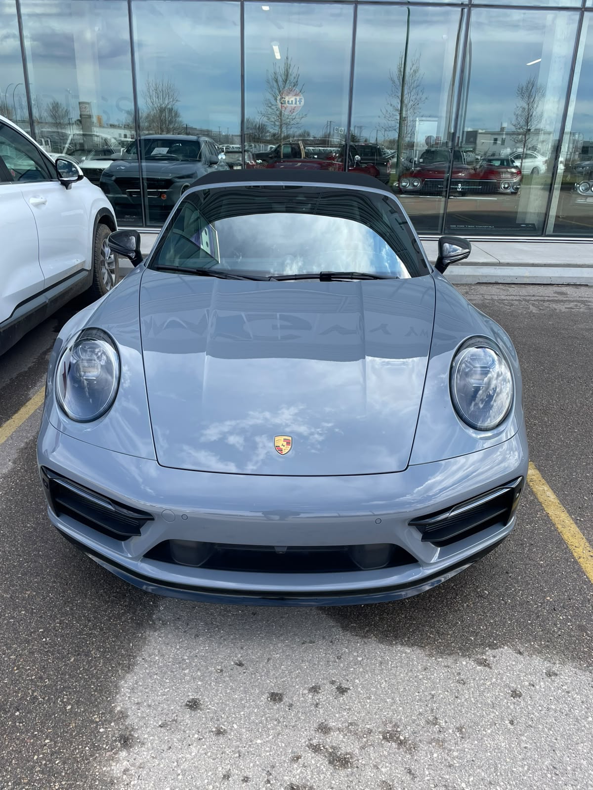 Grey sports coupe with detailed paint reflections