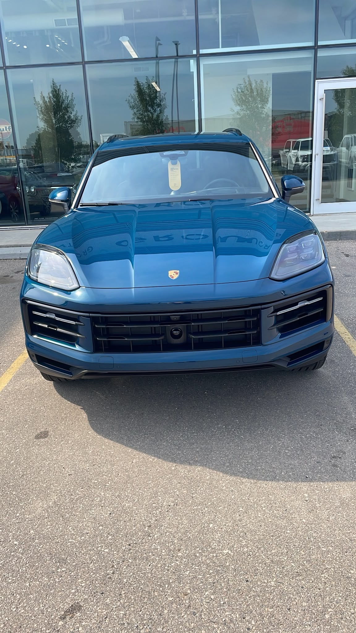 Detailed blue luxury SUV mirror-like paint reflection