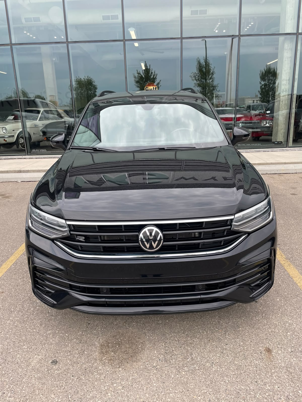 Black sport SUV with clean LED headlights and polished front grille